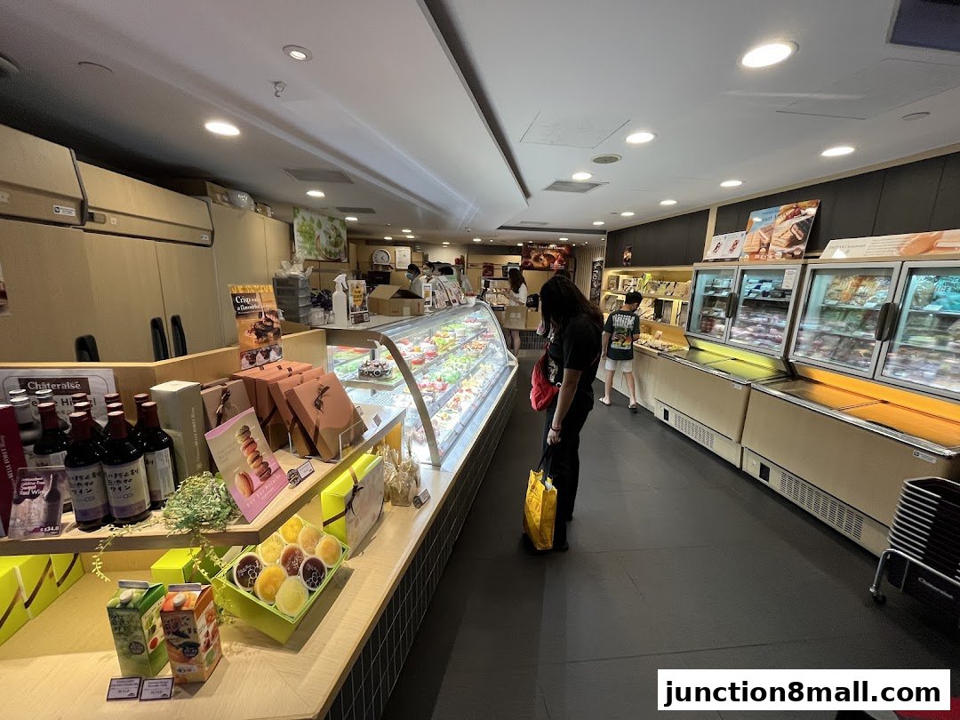 Interior view of a Châteraisé pastry shop with display cases filled with cakes and desserts.