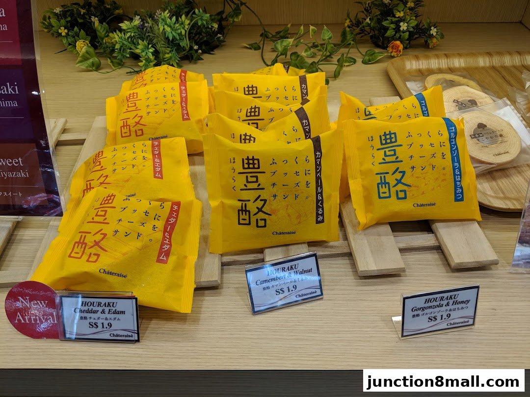Assortment of individually wrapped Châteraisé cheese sandwiches and Baumkuchen.