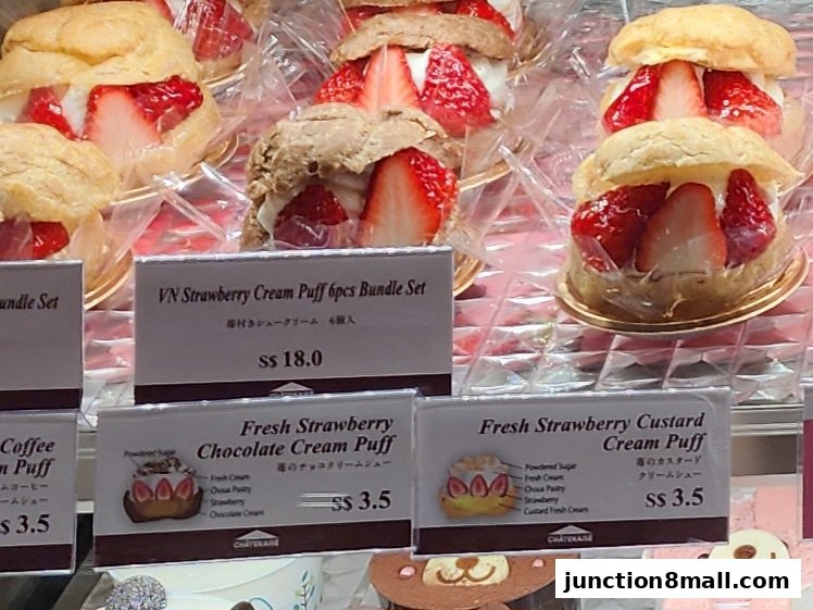 A display of fresh strawberry cream puffs and other pastries at Châteraisé.