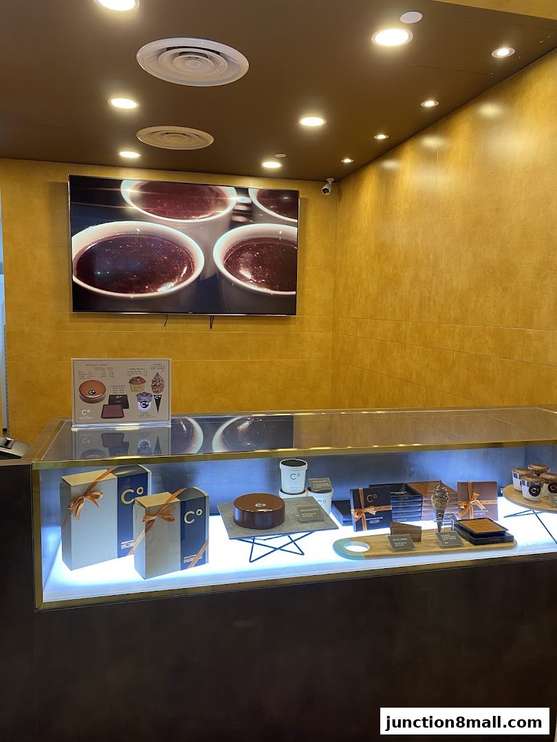 A display case filled with chocolates and gift boxes at Chocolate Origin.