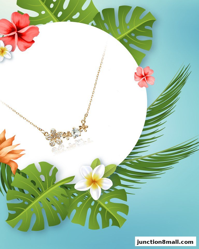 A delicate gold necklace with floral-shaped crystal pendants, surrounded by tropical leaves and flowers.