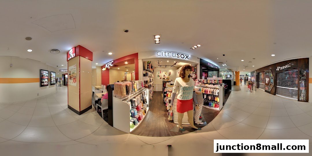 A wide view of a shopping mall corridor featuring Citrusox and KFC stores.