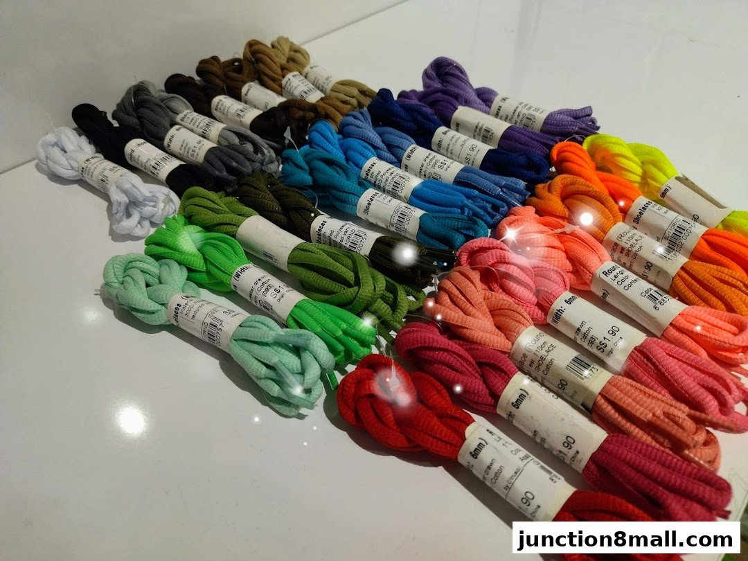 A vibrant display of colorful shoelaces neatly arranged in rows.