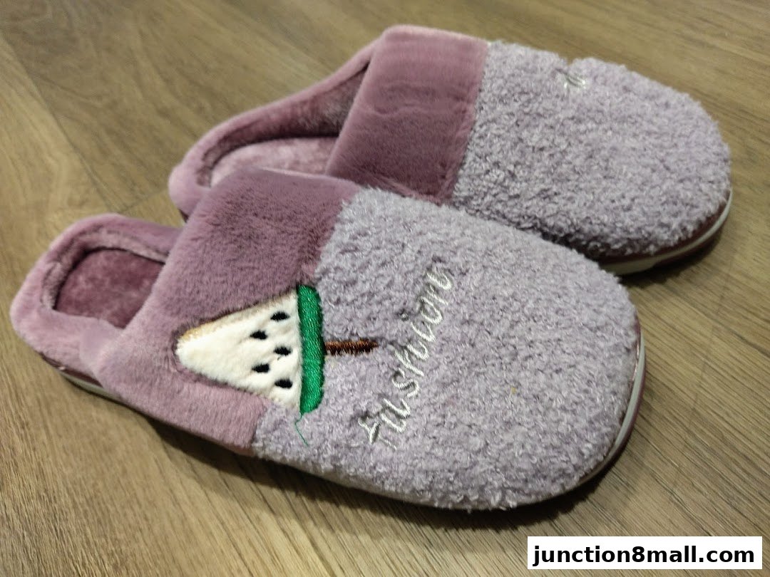 A pair of plush purple slippers with a watermelon design and the word 'Fashion'.