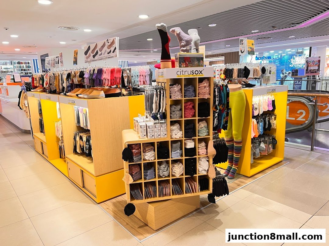 A retail display featuring a wide variety of colorful socks and legwear from Citrusox.