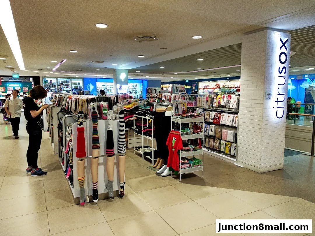 Interior view of Citrusox store showcasing a variety of socks and apparel on display racks.