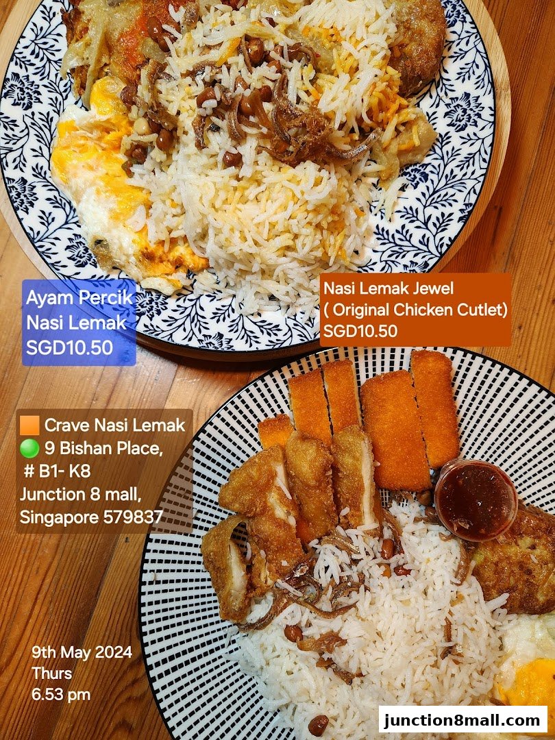 Two plates of Nasi Lemak, one with Ayam Percik and the other with chicken cutlet.
