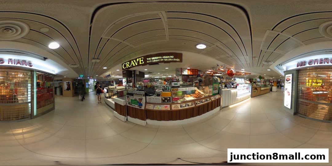 A panoramic view of the Crave Nasi Lemak shop front and surrounding mall corridor.