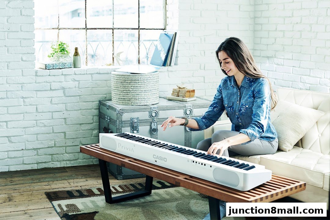A young woman plays a white Casio Privia digital piano in a bright, airy room.