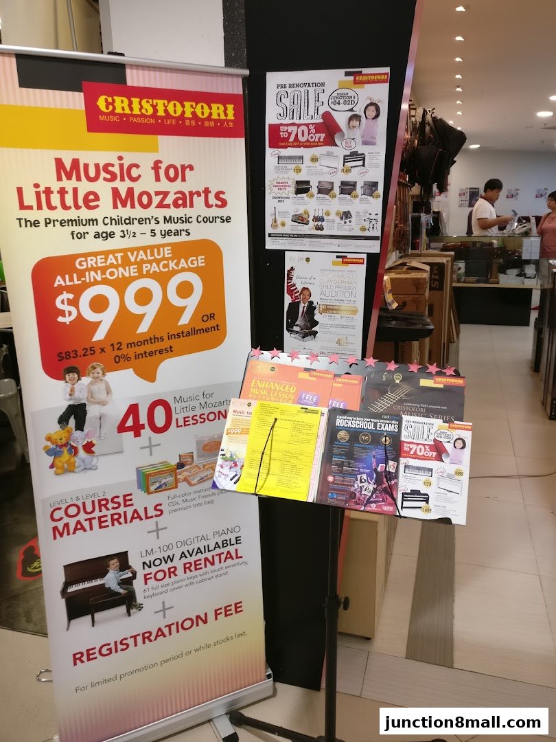 A music school's promotional display featuring courses, rentals, and sales.