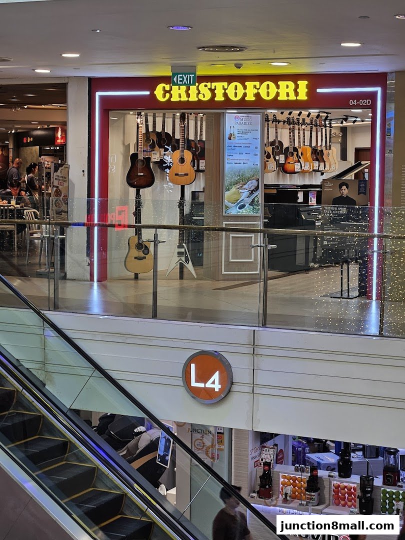 Cristofori Music School Bishan shop front with guitars displayed and an exit sign above.