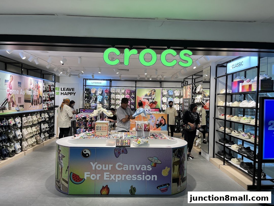 Interior view of a Crocs store showcasing various shoe styles and accessories.