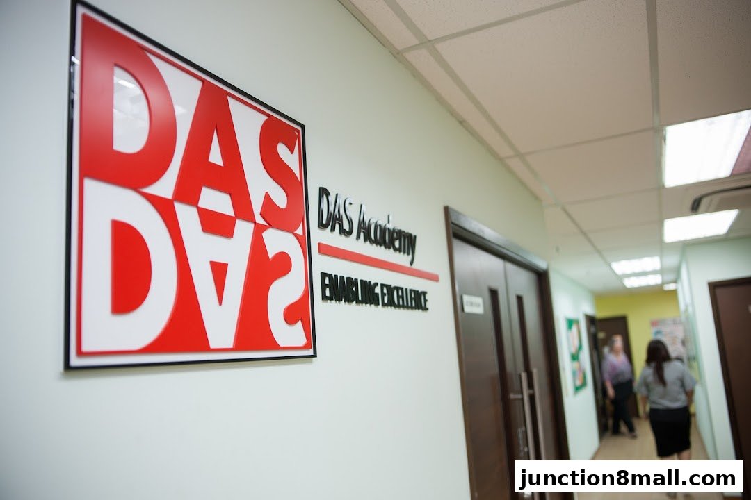 The interior hallway of DAS Academy with prominent signage and doors.
