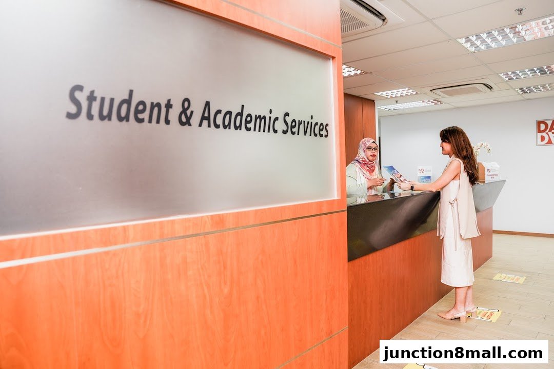 A student receives information at the reception desk of DAS Academy's Student & Academic Services.