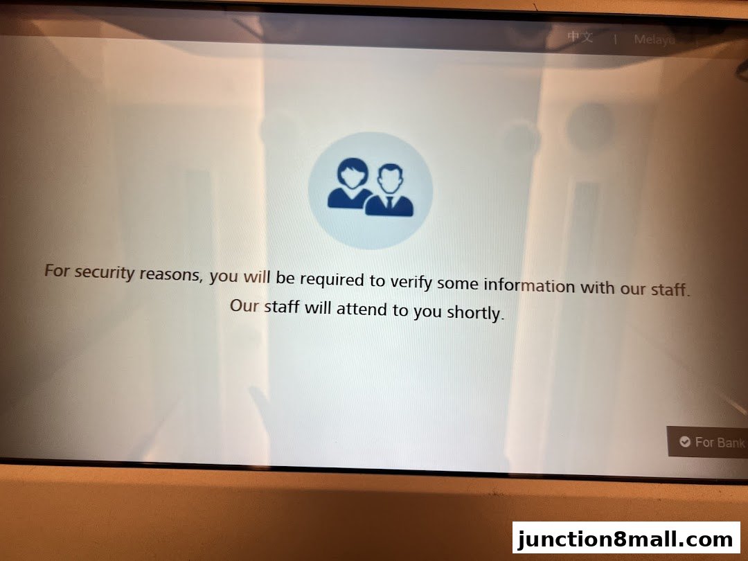 A screen displays a message about security verification and staff assistance.