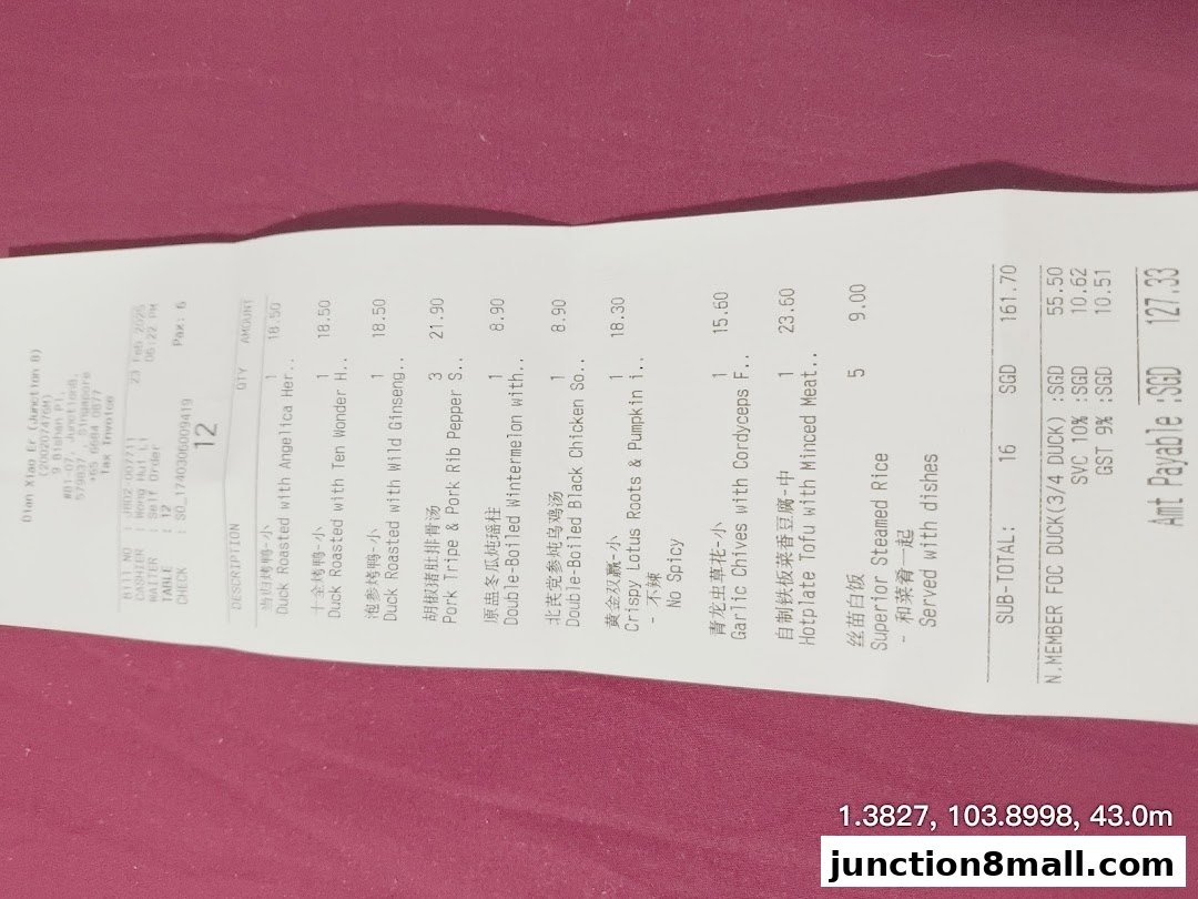 A receipt from Dian Xiao Er showing a list of roasted duck dishes and other Chinese cuisine items.