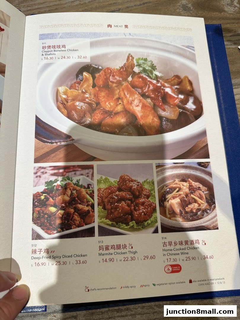 A menu page showcasing four different chicken dishes with appealing food photography.