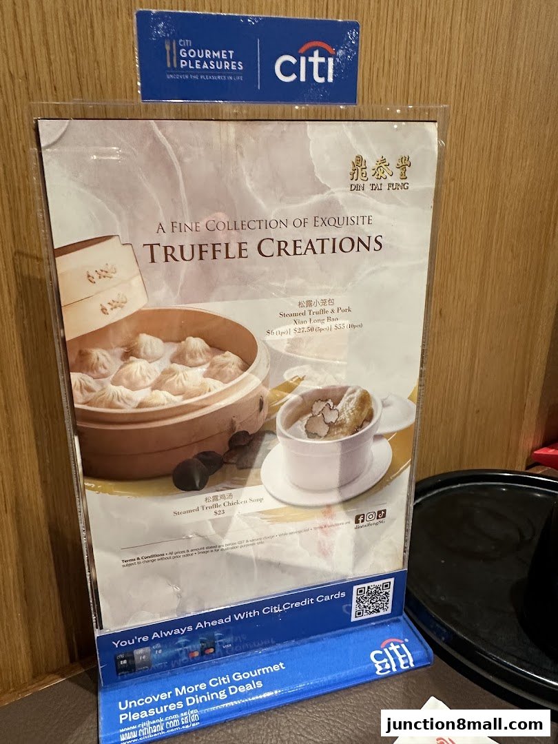 A menu featuring Din Tai Fung's truffle creations, including steamed truffle chicken soup and truffle pork xiao long bao.