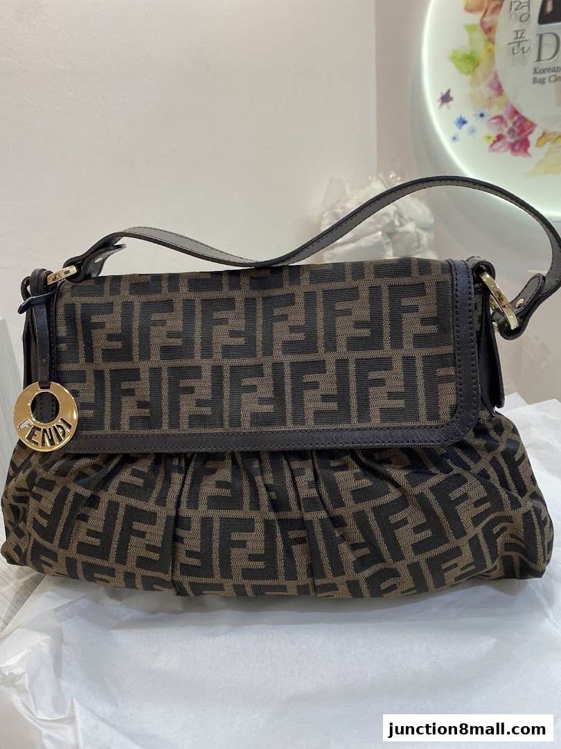 A Fendi baguette bag with the iconic FF logo pattern.