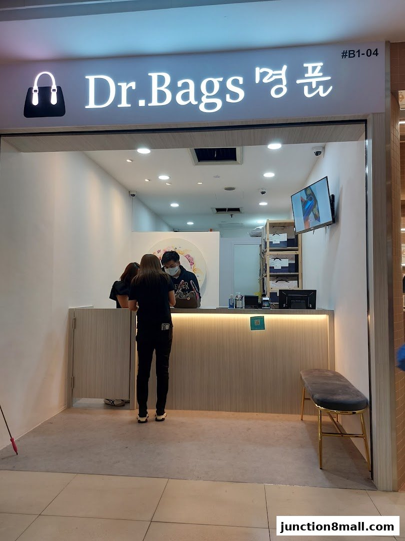 The entrance of Dr. Bags, a shop specializing in bags, with staff attending to customers.