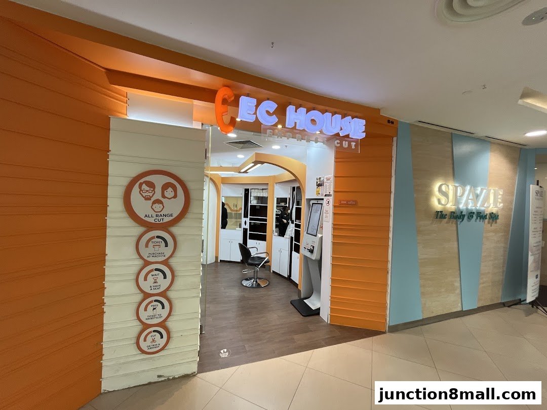 The entrance of EC House Express Cut hair salon with orange and white facade.