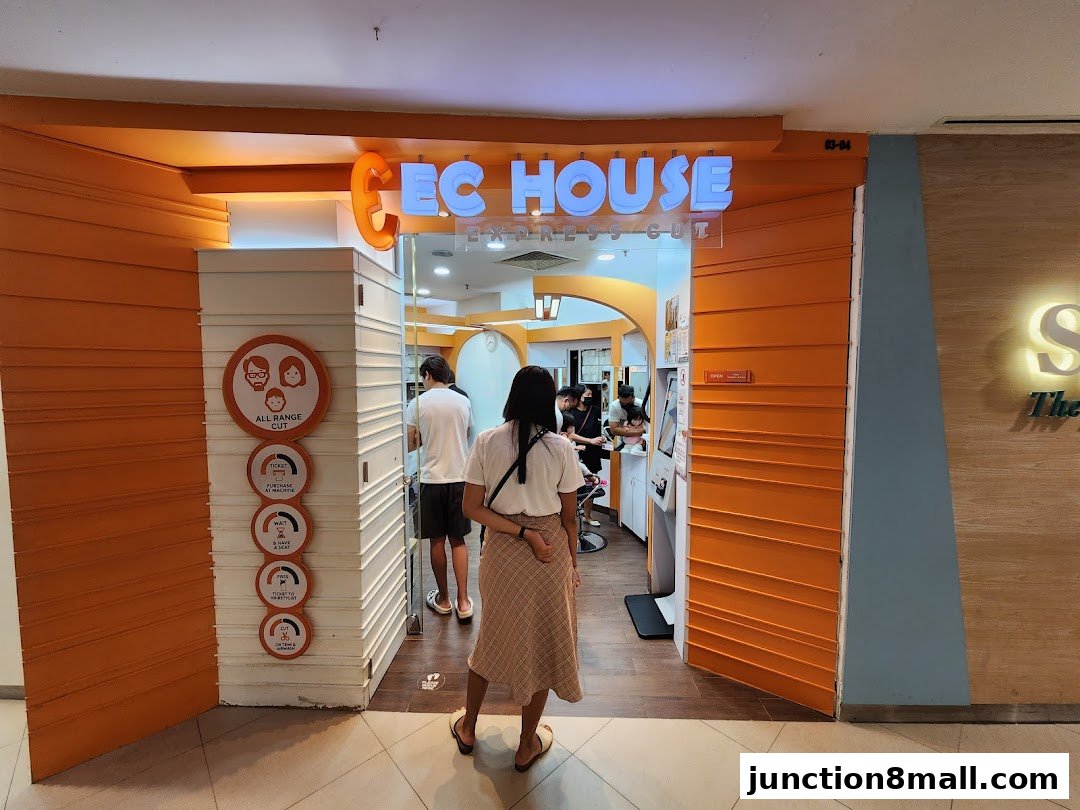 The entrance of EC House All Range Cuts hair salon with people waiting and a service flow chart.