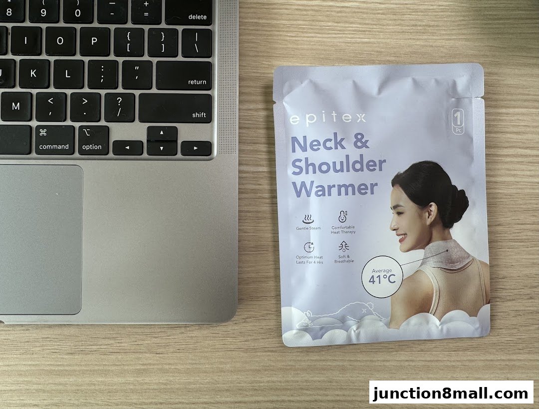 A package of Epitex Neck & Shoulder Warmer next to a laptop keyboard.
