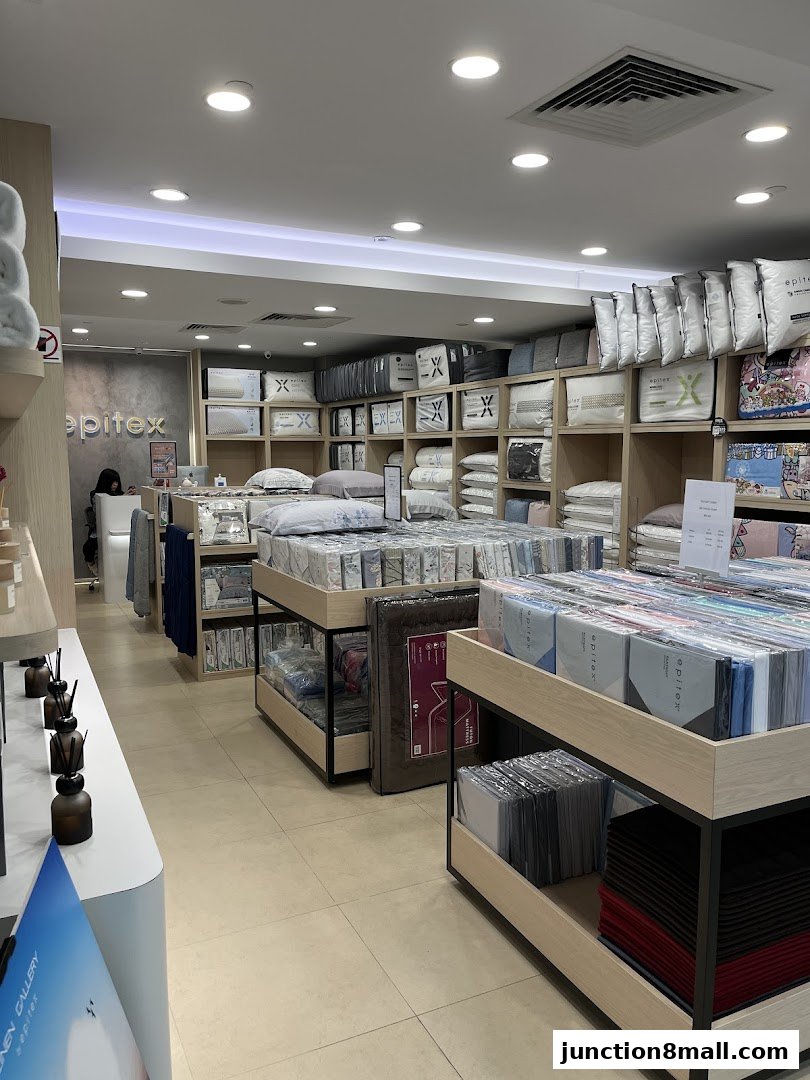 Interior view of Epitex Junction 8, showcasing bedding and linen products on display.
