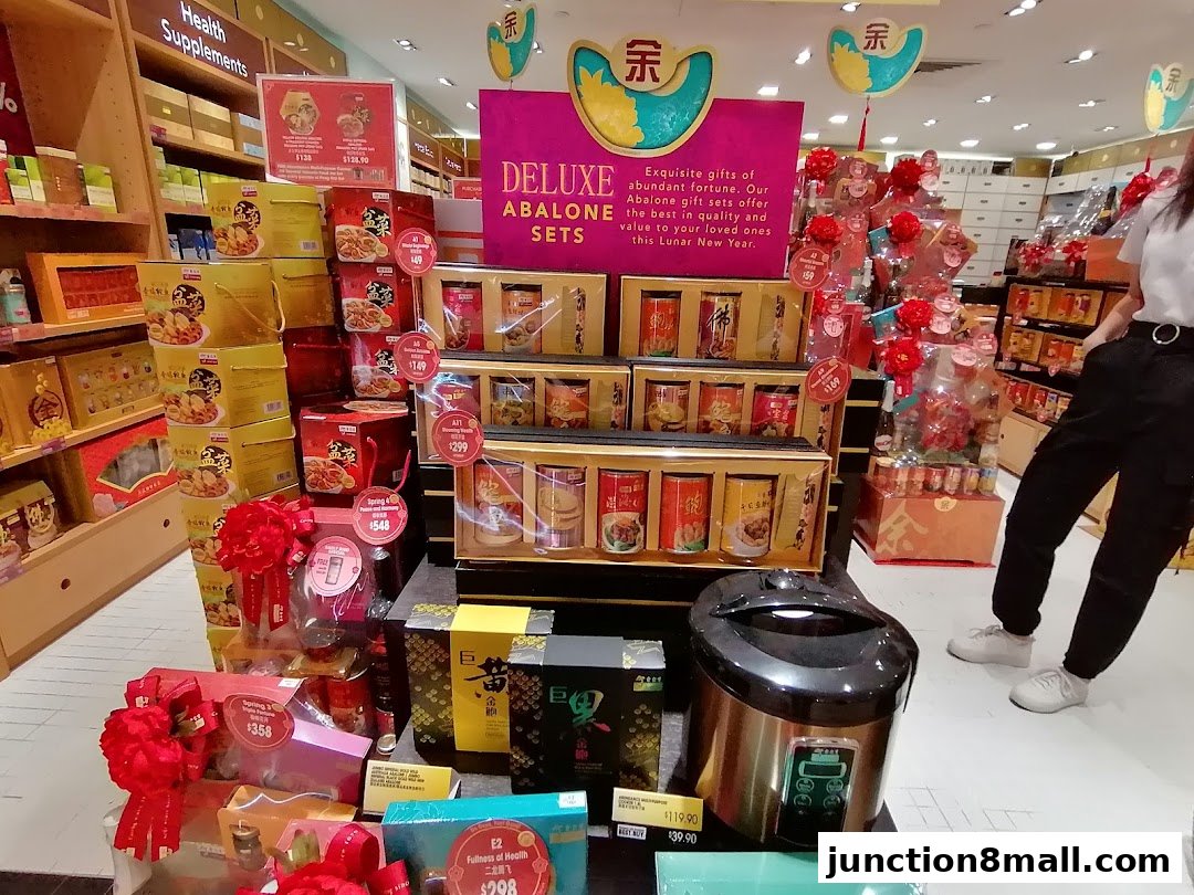A retail store display featuring deluxe abalone gift sets and other health supplements for Lunar New Year.