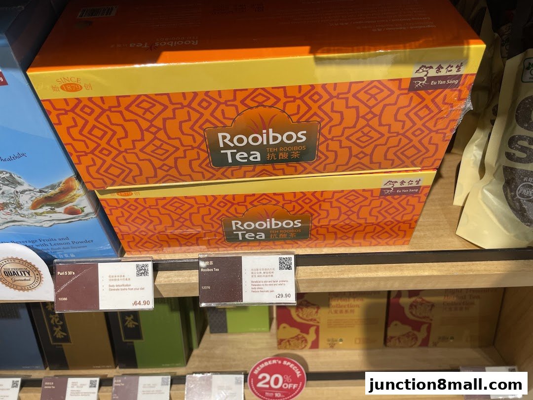 Boxes of Eu Yan Sang Rooibos Tea and other herbal teas displayed on shelves.