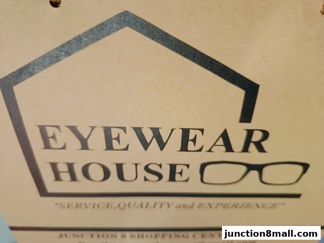 A sign for Eyewear House, featuring a house outline and glasses.