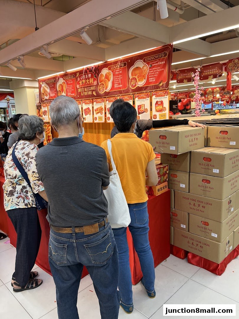 Customers browse festive gift packs and produce at a FairPrice Finest supermarket.