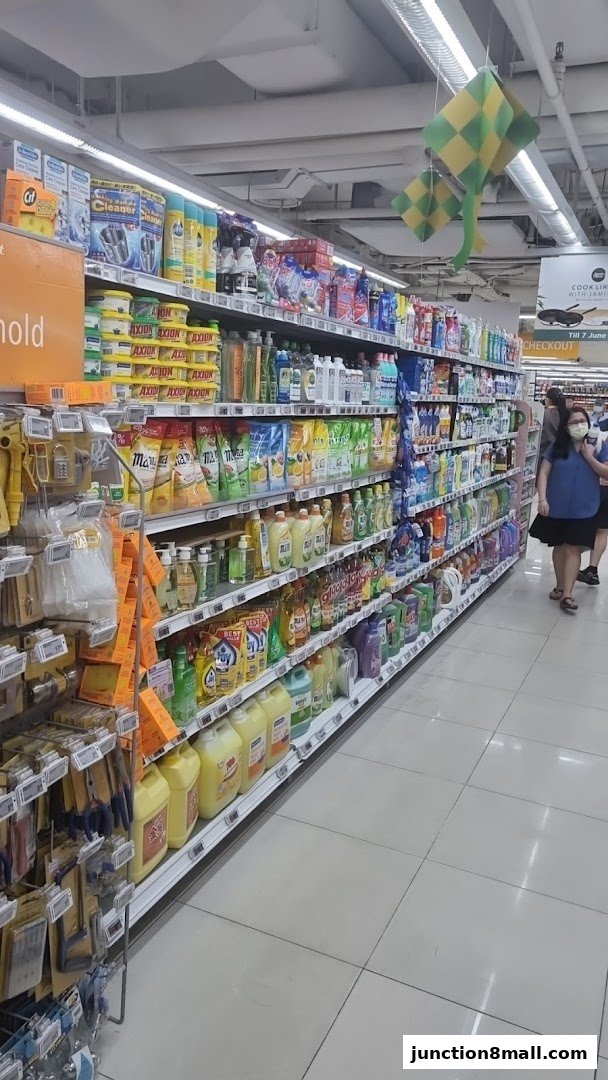 Aisle of cleaning supplies and household products in a supermarket.