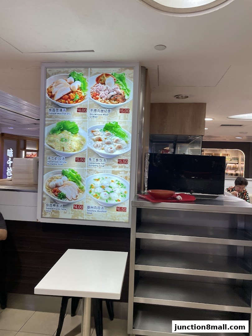 A menu board displaying various noodle and soup dishes with prices.