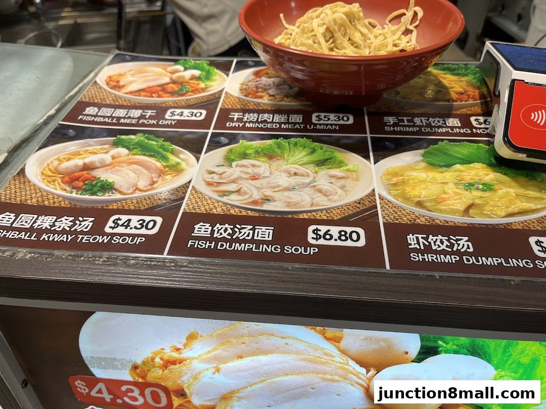 A menu display featuring various noodle dishes with pictures and prices.