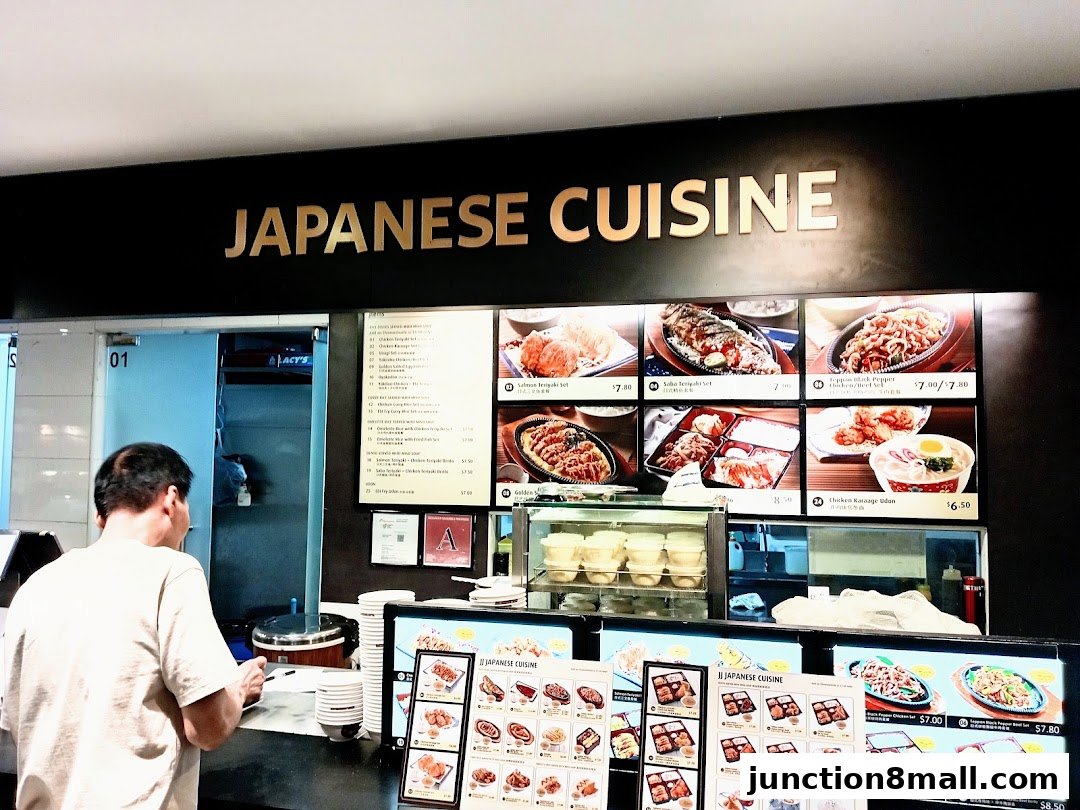 A customer orders Japanese cuisine at a food stall with a menu and food pictures.