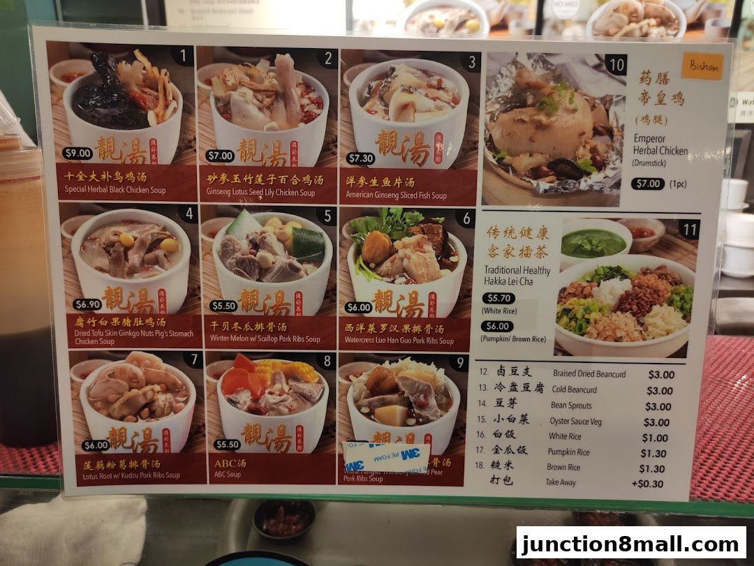 A menu board displaying various soups, chicken dishes, and side dishes with prices.