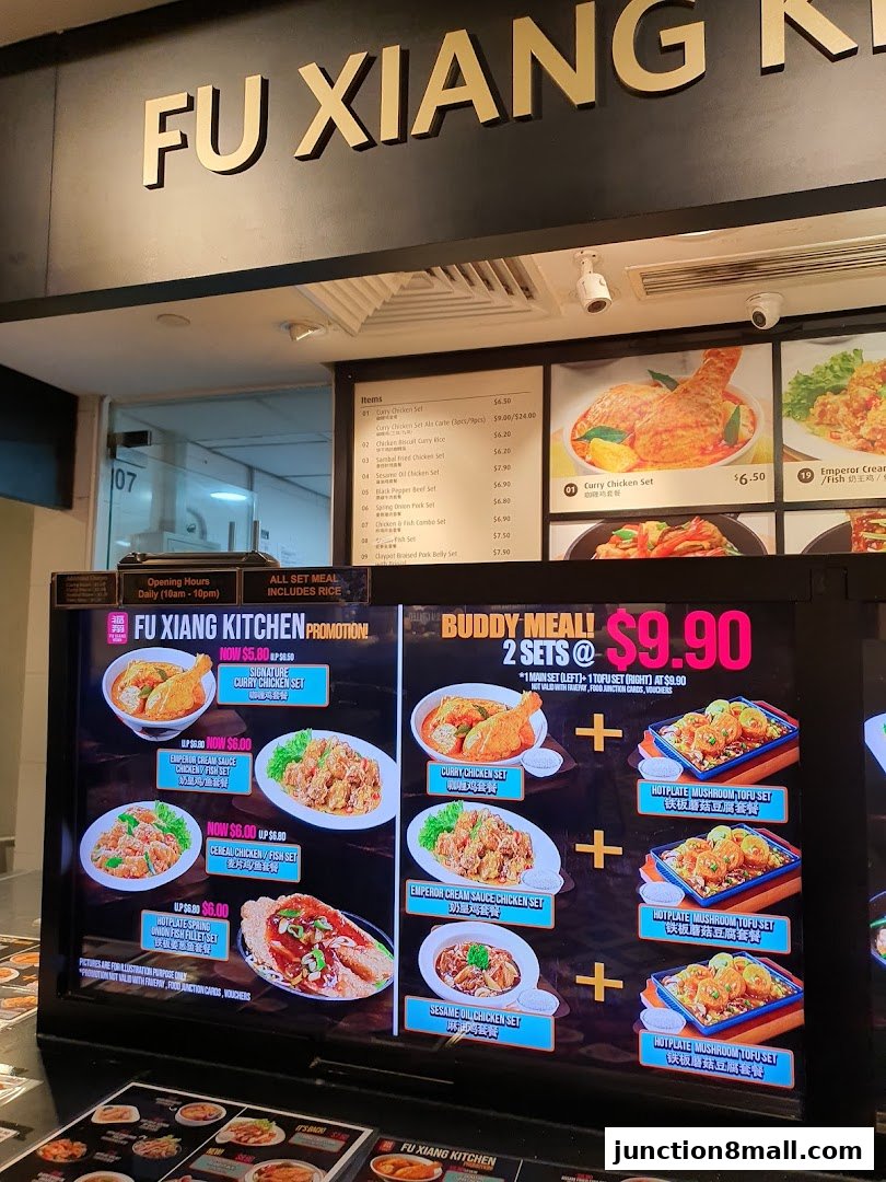 A digital menu board displaying various meal sets and promotions for Fu Xiang Kitchen.