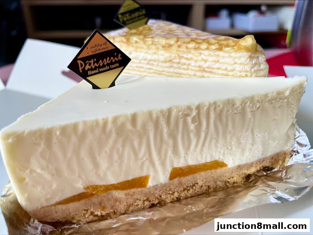 Two slices of delicious-looking cakes, one cheesecake and one crepe cake, from Four Leaves.