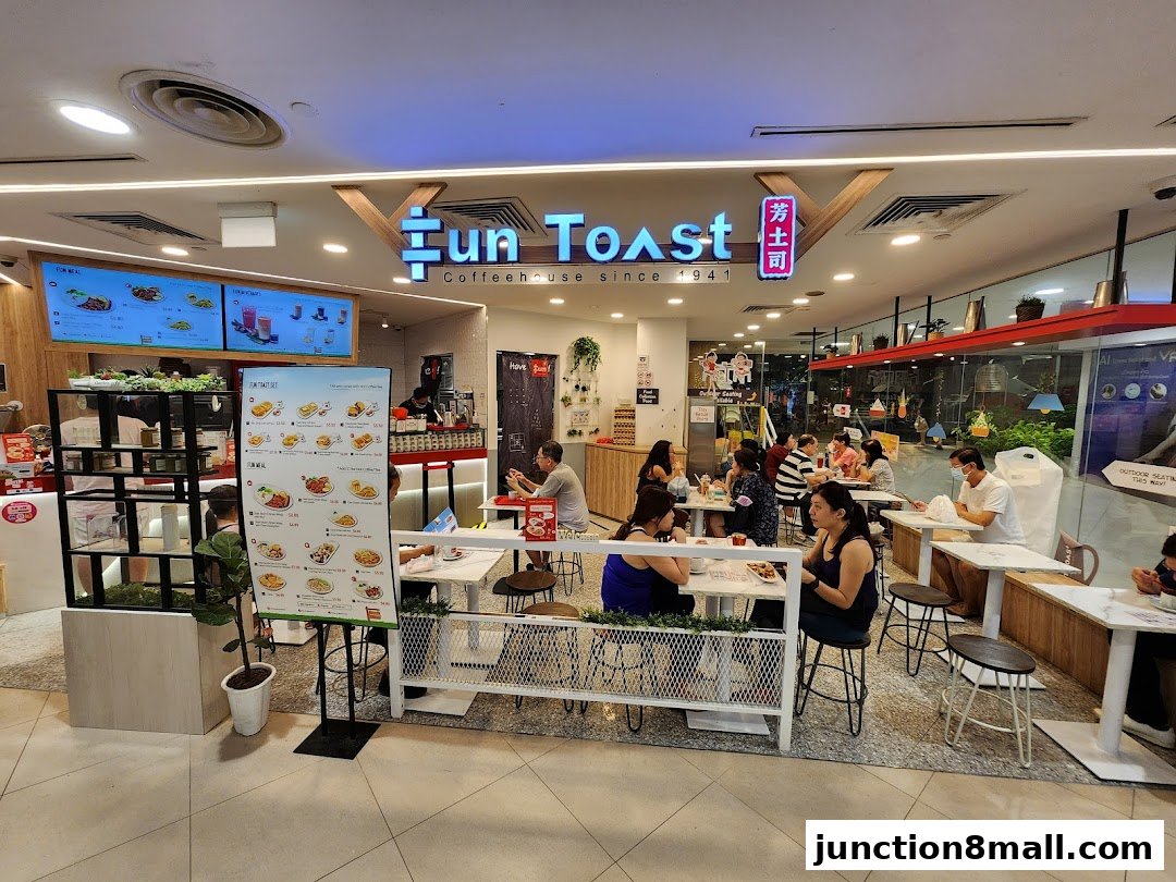 Interior view of Fun Toast cafe with customers dining and a menu displayed.