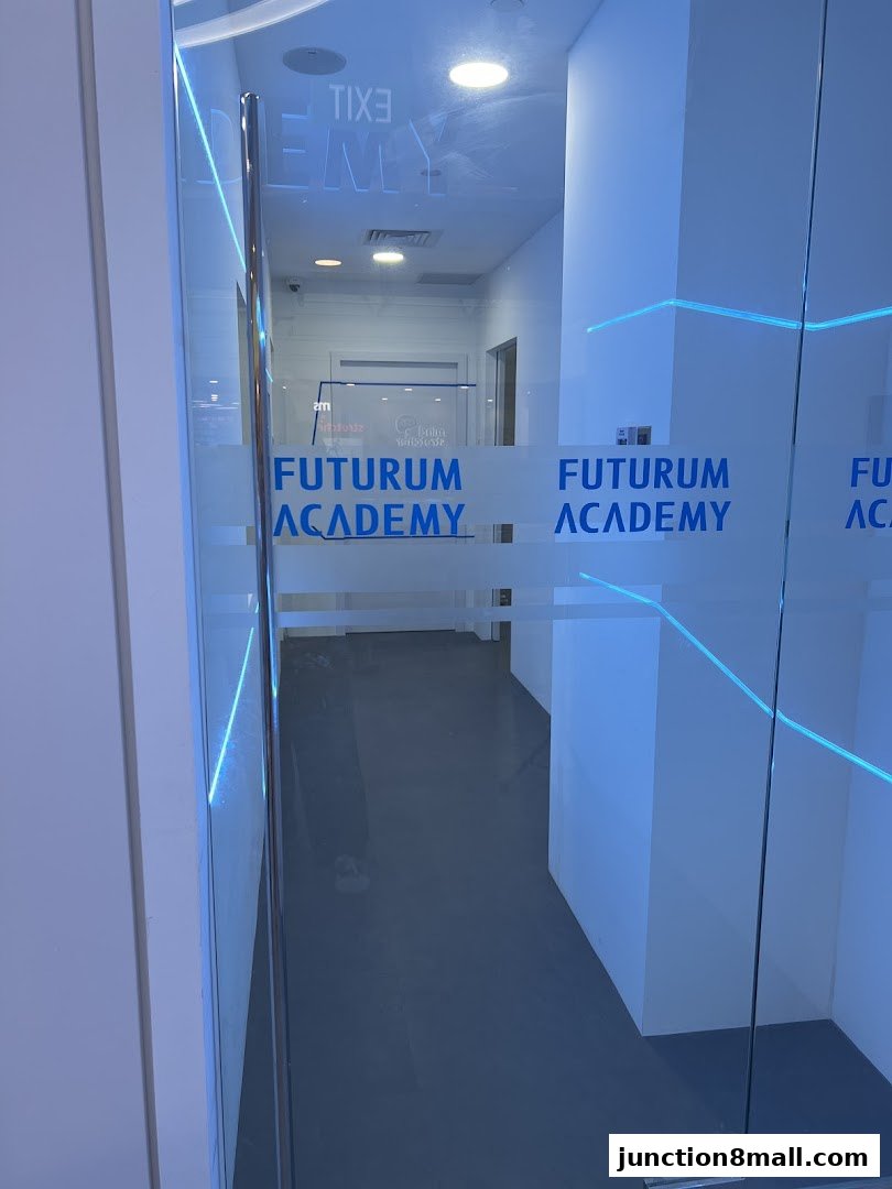 Entrance to Futurum Academy Bishan Campus with frosted glass doors and blue lighting.
