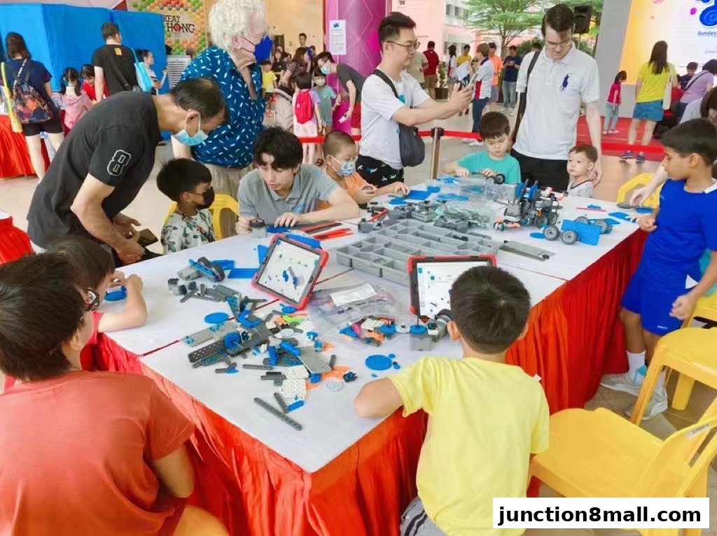 Children and adults engage in a robotics workshop with building blocks and tablets.