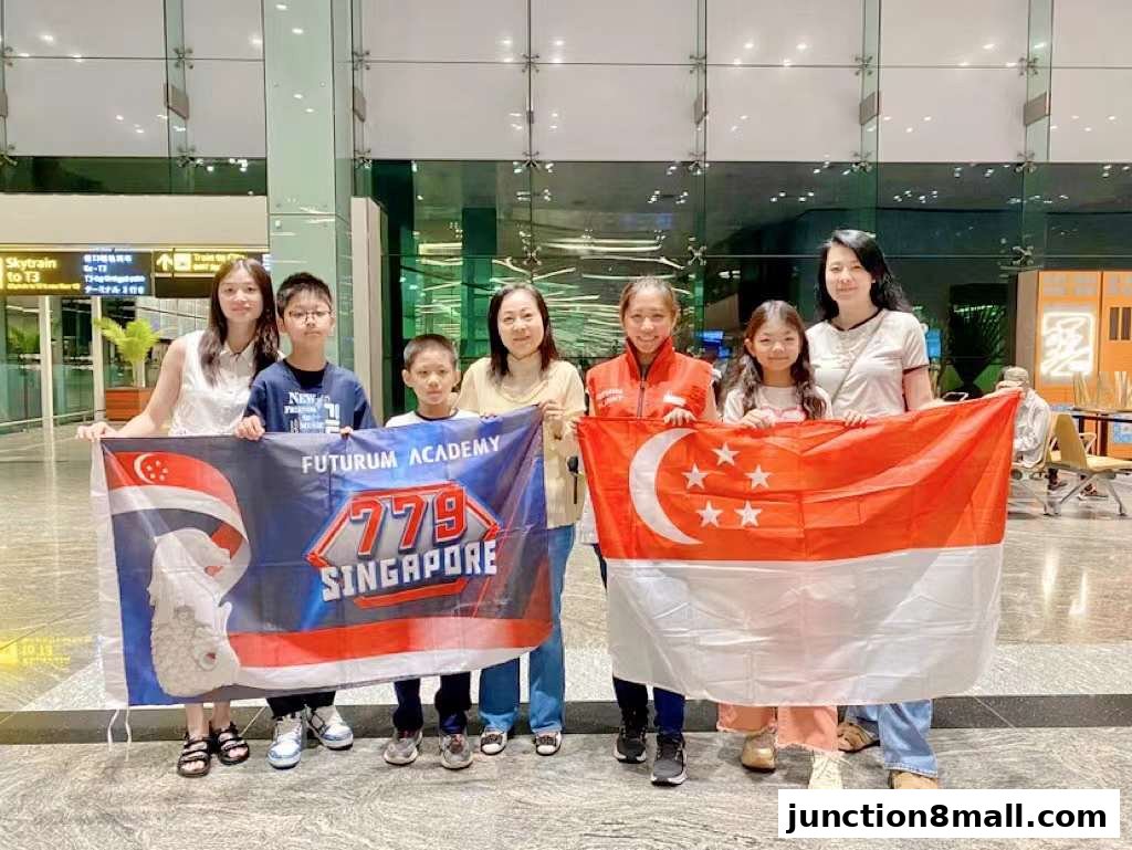A group of people holding Singapore flags and a Futurum Academy banner.