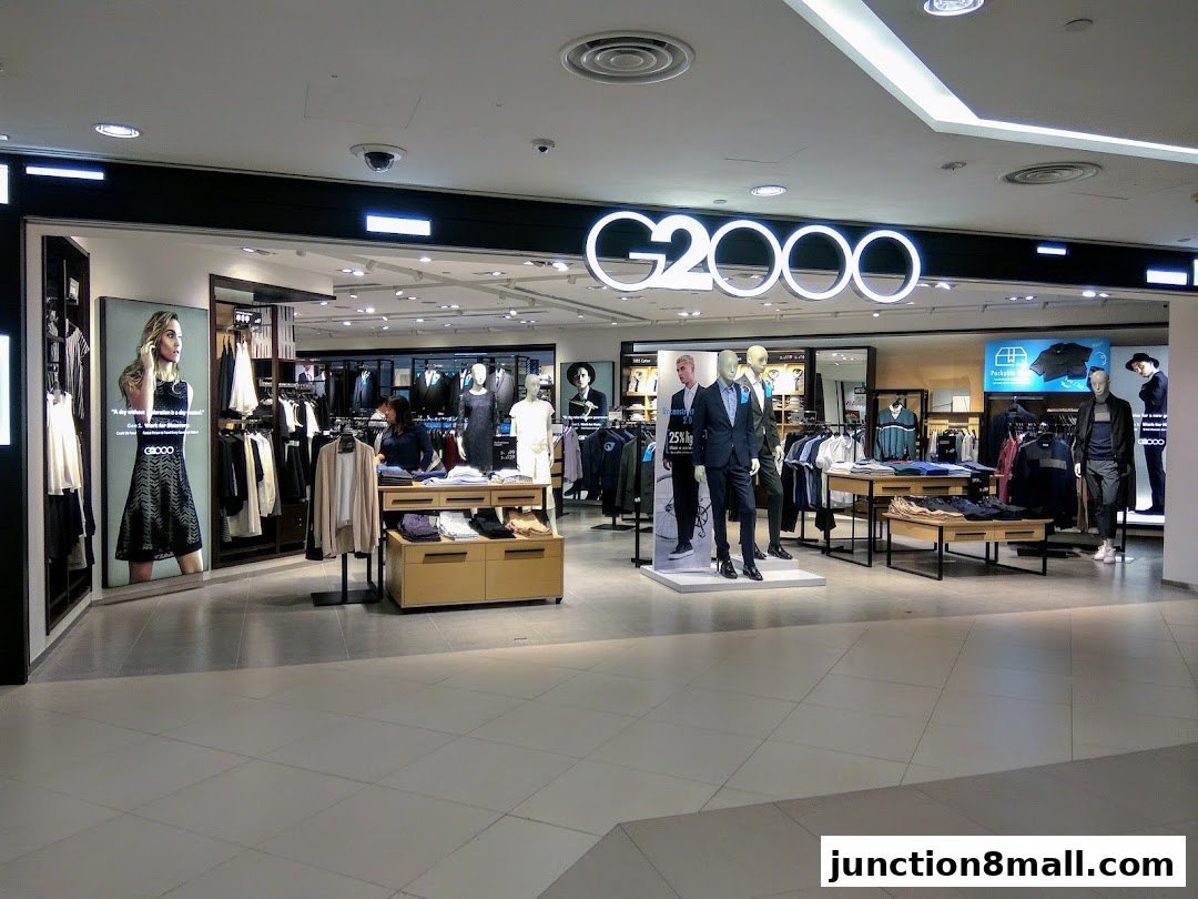 The G2000 shop displays men's and women's fashion with mannequins and clothing racks.