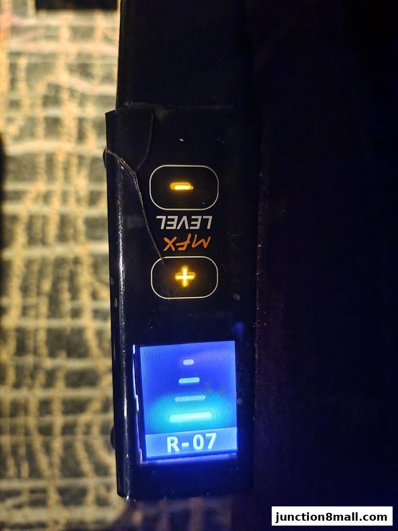 Close-up of a device with buttons and a digital display showing 'R-07'.