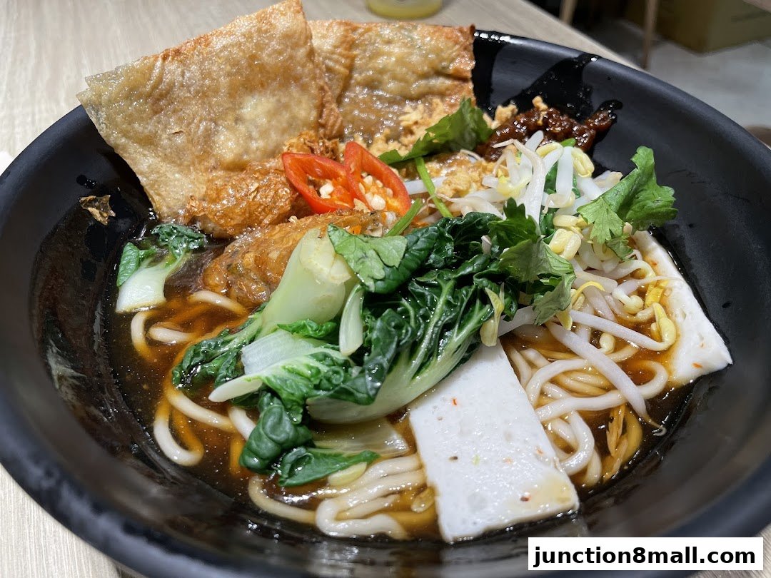 A close-up shot of a delicious bowl of noodles with various toppings.