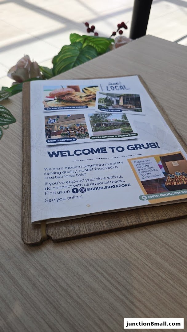 A menu from GRUB Junction 8, showcasing food and locations.