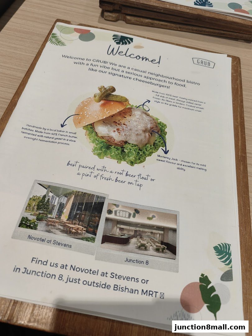 A menu page for GRUB Junction 8, featuring a signature cheeseburger and location information.