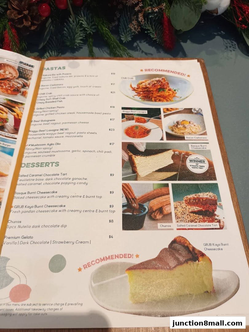 A menu from GRUB Junction 8 featuring pasta dishes and desserts with accompanying images.