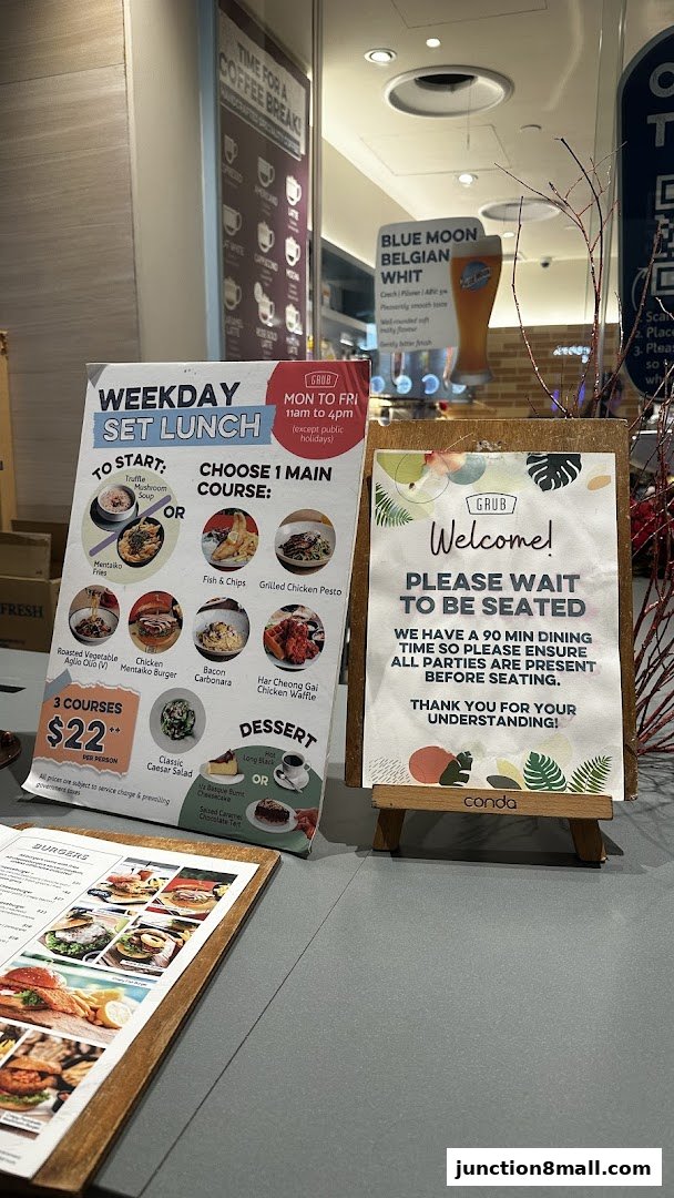 A restaurant display featuring a weekday set lunch menu and a welcome sign.